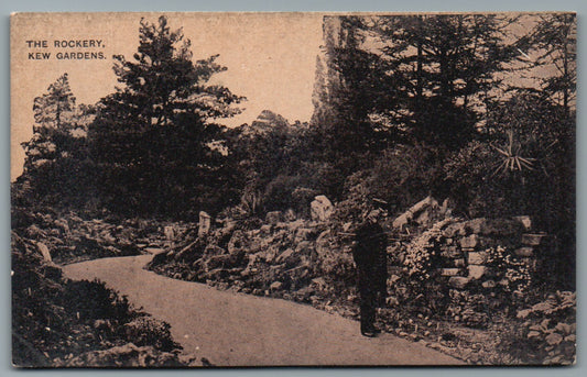 This is a Vintage Topographical Postcard showing Kew Gardens The Rockery with Park Keeper
